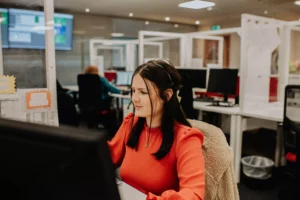 Kerrie Doonan handling calls at customer service and taking orders at Unilin Insulation